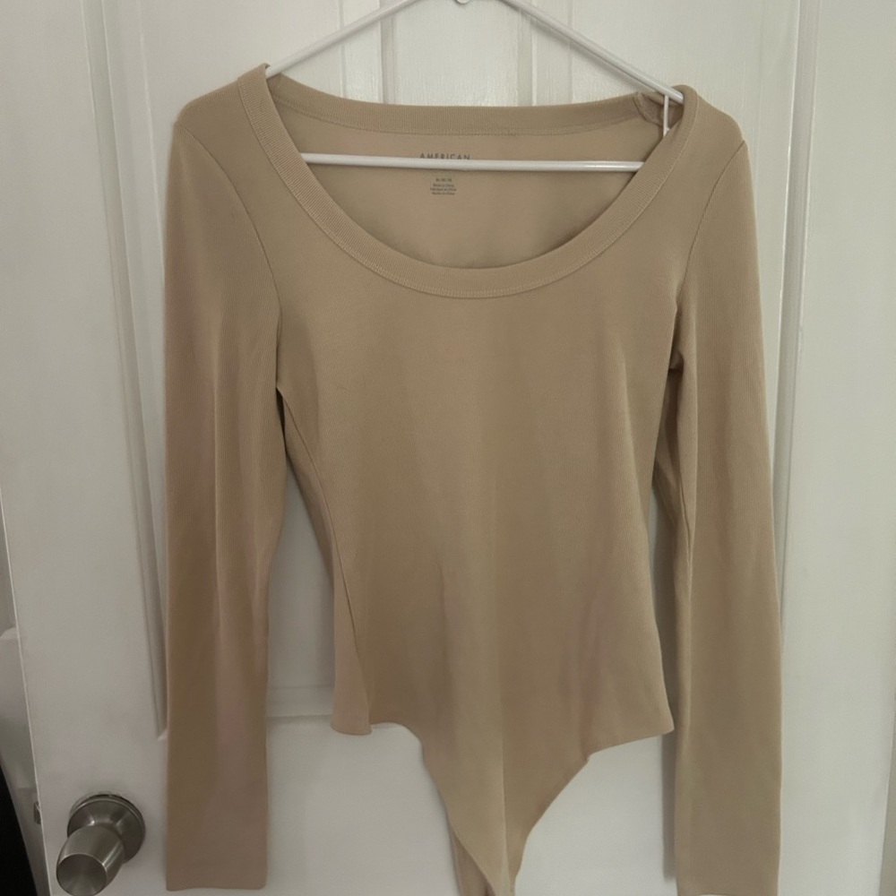 tan lined body suit